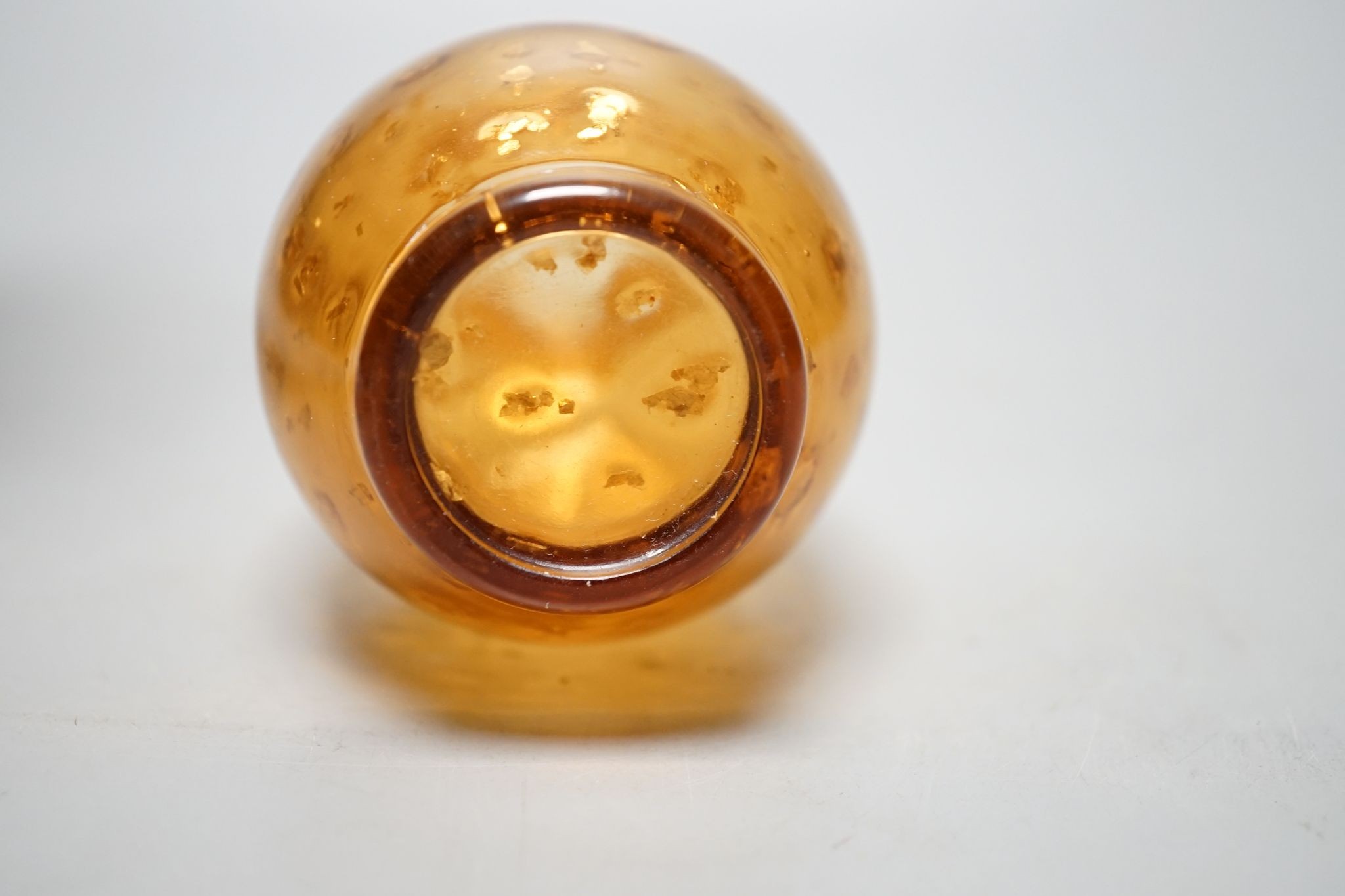 A Chinese gilt included amber glass vase., 9 cms high.